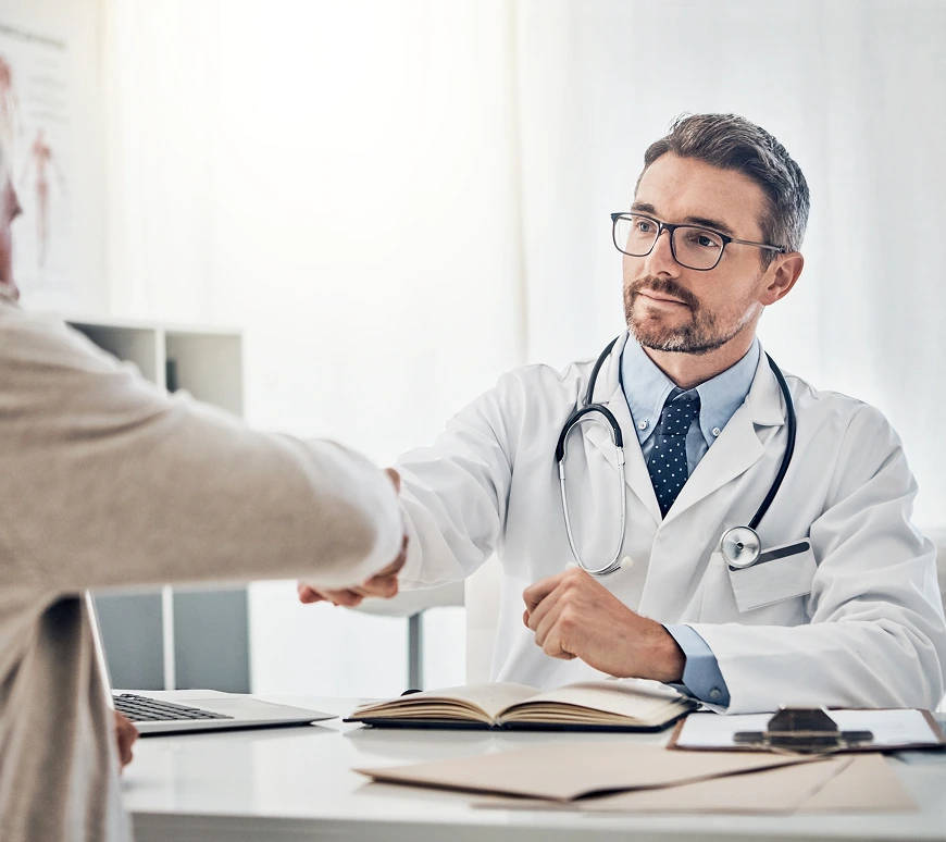 doctor shaking hands with his patient